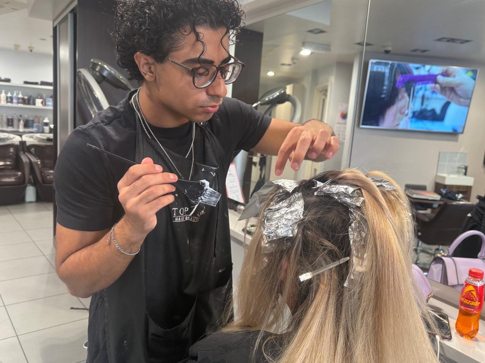 Imad applying half head highlights at TopOne Richmond